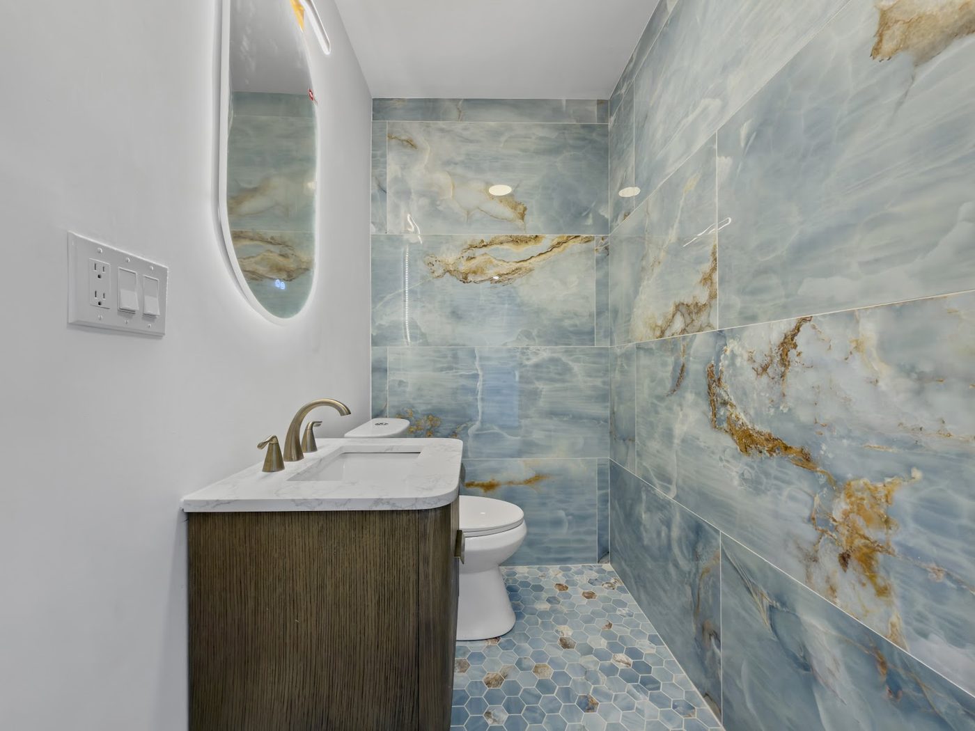 Styled bathroom photo with marble finishes