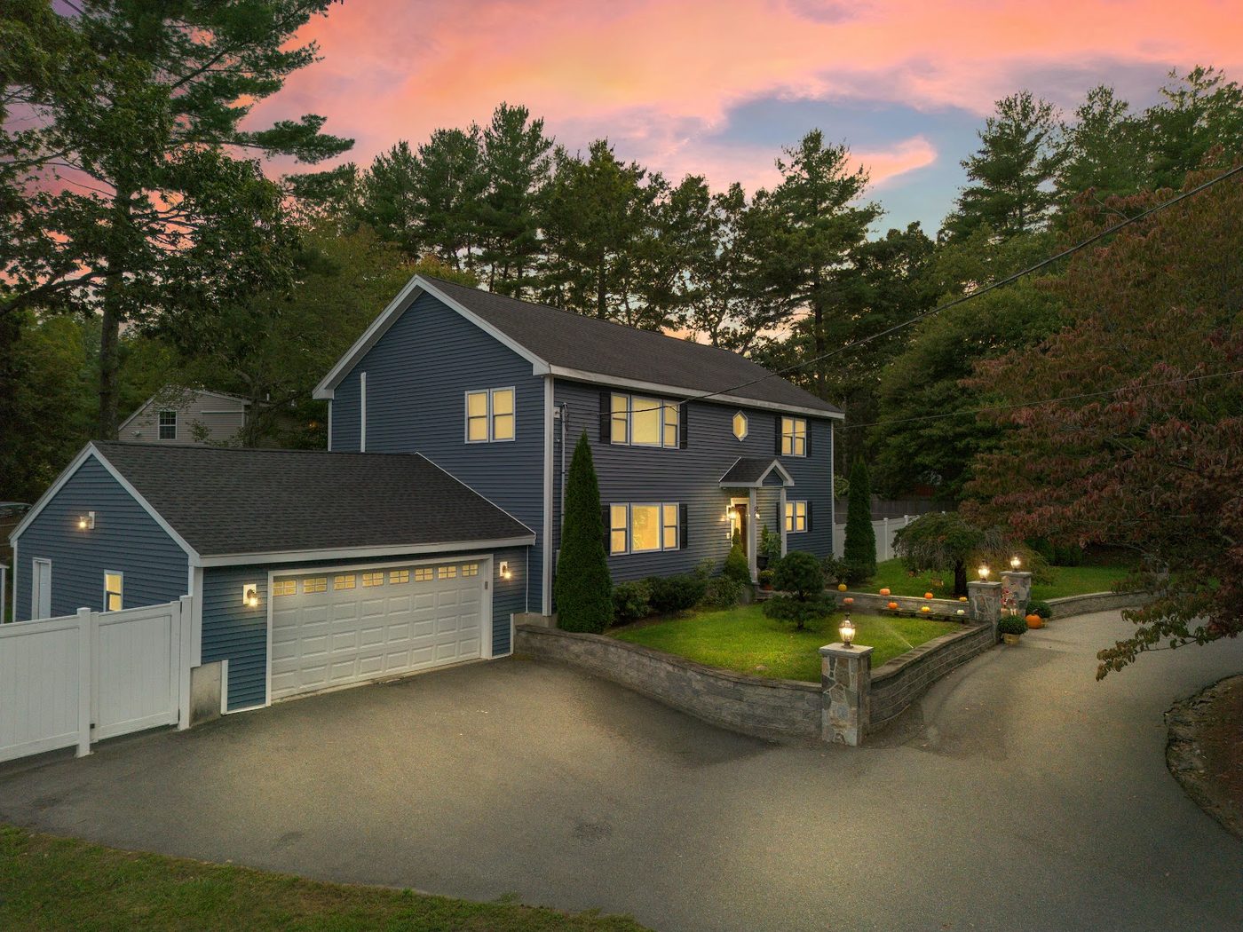 Twilight aerial photo of a Massachusetts home, shot by Marcel Wynn